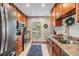 Well-lit kitchen featuring granite countertops and stainless steel appliances at 1515 Bayshore Blvd # 38, Dunedin, FL 34698