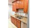 Updated kitchen with granite countertops, stainless steel appliances, and stylish wood cabinets at 1515 Bayshore Blvd # 38, Dunedin, FL 34698