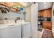 Efficient laundry area featuring a side-by-side washer and dryer near the kitchen at 1515 Bayshore Blvd # 38, Dunedin, FL 34698