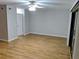 Spacious living room with wood floors, a ceiling fan, and sliding glass doors at 1515 Bayshore Blvd # 38, Dunedin, FL 34698