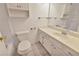 Clean and bright bathroom featuring white cabinets, sink, and toilet, perfect for everyday use at 1604 Comfy Ct, Sun City Center, FL 33573