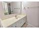 Clean bathroom vanity with white cabinets and a large mirror at 1604 Comfy Ct, Sun City Center, FL 33573