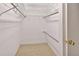 Walk-in closet with metal racking and tile flooring at 1604 Comfy Ct, Sun City Center, FL 33573