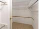 Walk-in closet featuring tile floors and basic storage at 1604 Comfy Ct, Sun City Center, FL 33573