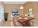 Dining room with modern furniture, lighting and decor at 1604 Comfy Ct, Sun City Center, FL 33573