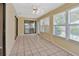 Spacious Florida room with tile flooring, windows, and sliding door access to the exterior at 1604 Comfy Ct, Sun City Center, FL 33573