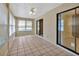 Bright Florida room with tile flooring, ceiling fan, and windows with adjustable blinds at 1604 Comfy Ct, Sun City Center, FL 33573