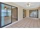 Enclosed Florida room with tile floor and multiple sliding doors offering ample natural light at 1604 Comfy Ct, Sun City Center, FL 33573
