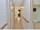 Bright hallway featuring closet space and leading into a brightly lit room at 1604 Comfy Ct, Sun City Center, FL 33573