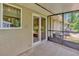 Screened-in lanai with sliding glass doors provides a comfortable and private space for relaxation and outdoor enjoyment at 1604 Comfy Ct, Sun City Center, FL 33573