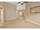 Bright living room with tile flooring, ceiling fan and view into other rooms at 1604 Comfy Ct, Sun City Center, FL 33573