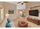 Inviting living room featuring a cozy couch and decorative coffee table leading to a dining area at 1604 Comfy Ct, Sun City Center, FL 33573