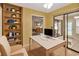 Bright and functional home office with a clean white desk setup and views into other rooms at 1604 Comfy Ct, Sun City Center, FL 33573