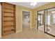 Versatile room with built-in shelving, offering flexible space for living, working, or storage at 1604 Comfy Ct, Sun City Center, FL 33573