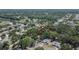 Aerial view of a home in a neighborhood with mature trees and well-maintained lawns at 1613 Long Pond Dr, Valrico, FL 33594