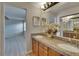 Bathroom featuring double vanity, granite countertop, and wood cabinets at 1613 Long Pond Dr, Valrico, FL 33594