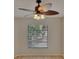 Bedroom with lighted ceiling fan and window at 1613 Long Pond Dr, Valrico, FL 33594