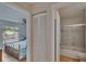 Bedroom with view to bathroom, closets, and bed at 1613 Long Pond Dr, Valrico, FL 33594