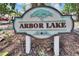 Arbor Lake community sign with decorative tree emblem at 1613 Long Pond Dr, Valrico, FL 33594