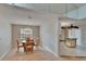 Cozy dining area with a chandelier, wood floors and seating for four at 1613 Long Pond Dr, Valrico, FL 33594
