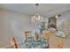 Dining room area with wood floors, chandelier and view of the fireplace at 1613 Long Pond Dr, Valrico, FL 33594