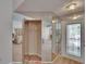Bright entryway with mirrors and a closet, leading to dining and living areas at 1613 Long Pond Dr, Valrico, FL 33594