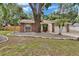 Single-story home with brick accents, mature trees and established landscaping at 1613 Long Pond Dr, Valrico, FL 33594