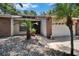 Inviting home exterior showcasing well-manicured landscaping, brick accents, and an attached two-car garage at 1613 Long Pond Dr, Valrico, FL 33594