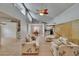 Open living area with ceiling fan, and views of the dining room and kitchen at 1613 Long Pond Dr, Valrico, FL 33594