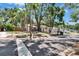 A well maintained single story home on a corner lot boasts mature trees, established landscaping, and a two car garage at 1613 Long Pond Dr, Valrico, FL 33594