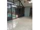 Enclosed sunroom with tile flooring and access to the inviting outdoor pool area, perfect for relaxation and entertainment at 1613 Long Pond Dr, Valrico, FL 33594