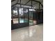 Spacious sunroom with tile flooring and clear views of the outdoor pool at 1613 Long Pond Dr, Valrico, FL 33594