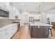 Spacious, modern eat-in kitchen with an expansive island, stainless appliances and ample cabinetry at 17566 Hyland Ln, Dade City, FL 33523