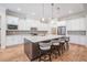 Modern eat-in kitchen island and seating, stainless appliances and ample cabinetry at 17566 Hyland Ln, Dade City, FL 33523