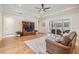 Spacious living room with tray ceiling and sliding glass doors to the lanai at 17566 Hyland Ln, Dade City, FL 33523