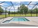 A refreshing pool provides a place to cool off, while enjoying the privacy of the screened lanai at 17566 Hyland Ln, Dade City, FL 33523