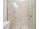 Walk-in shower showcasing elegant tile work, glass enclosure, and modern fixtures at 17566 Hyland Ln, Dade City, FL 33523