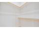 A walk-in closet with two levels of racks at 17566 Hyland Ln, Dade City, FL 33523