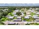 Wide aerial showing this lovely villa within a lushly landscaped community at 1802 Bedford Ter # 185, Sun City Center, FL 33573