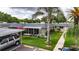 Charming single story villa with carport, screened lanai, lush landscaping, and convenient guest parking at 1802 Bedford Ter # 185, Sun City Center, FL 33573
