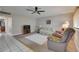 Comfortable living room featuring neutral tones, tile entryway, and cozy seating at 1802 Bedford Ter # 185, Sun City Center, FL 33573