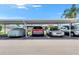 Convenient covered parking area featuring assigned spots and well-maintained surroundings at 1802 Bedford Ter # 185, Sun City Center, FL 33573