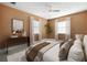 Charming bedroom with orange walls, and great natural light from two windows at 1813 Lakeview Dr, Brandon, FL 33511