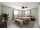Cozy bedroom featuring neutral tones, a ceiling fan, and natural light from two windows at 1813 Lakeview Dr, Brandon, FL 33511