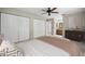 Bedroom featuring a ceiling fan, closet space, and access to the bathroom at 1813 Lakeview Dr, Brandon, FL 33511