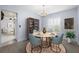 Inviting dining room features a modern chandelier and coordinated decor at 1813 Lakeview Dr, Brandon, FL 33511