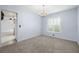 Open dining room showcases a modern chandelier and plantation shutters at 1813 Lakeview Dr, Brandon, FL 33511