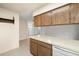 Kitchen area with ample counter space and view towards living area at 1813 Lakeview Dr, Brandon, FL 33511