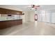 Open-concept living room with tile flooring and a view of the kitchen at 1813 Lakeview Dr, Brandon, FL 33511