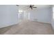 Spacious living room shows neutral carpet, ceiling fan, with views into dining room at 1813 Lakeview Dr, Brandon, FL 33511